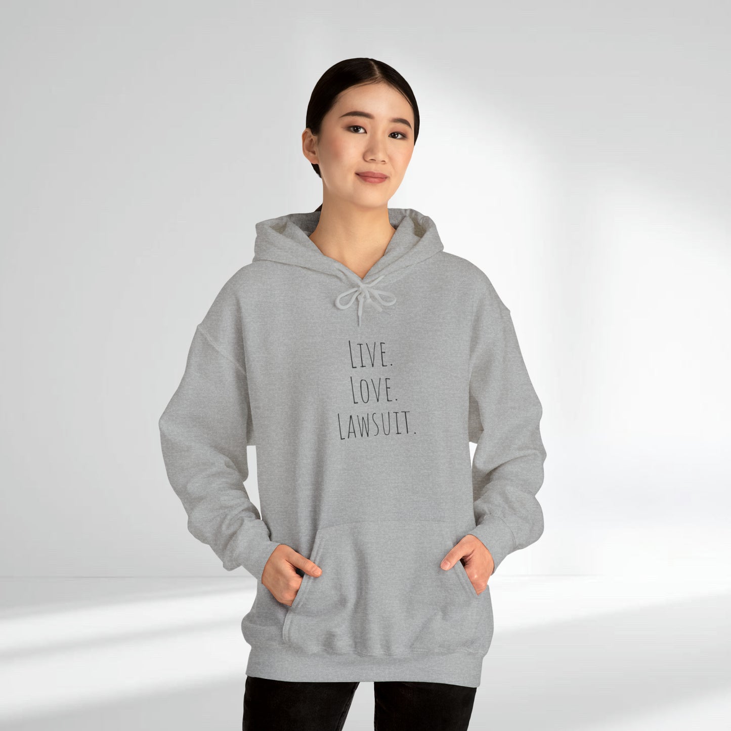 "Live. Laugh. Lawsuit." Statement Unisex Heavy Blend™ Hooded Sweatshirt - Hoodie