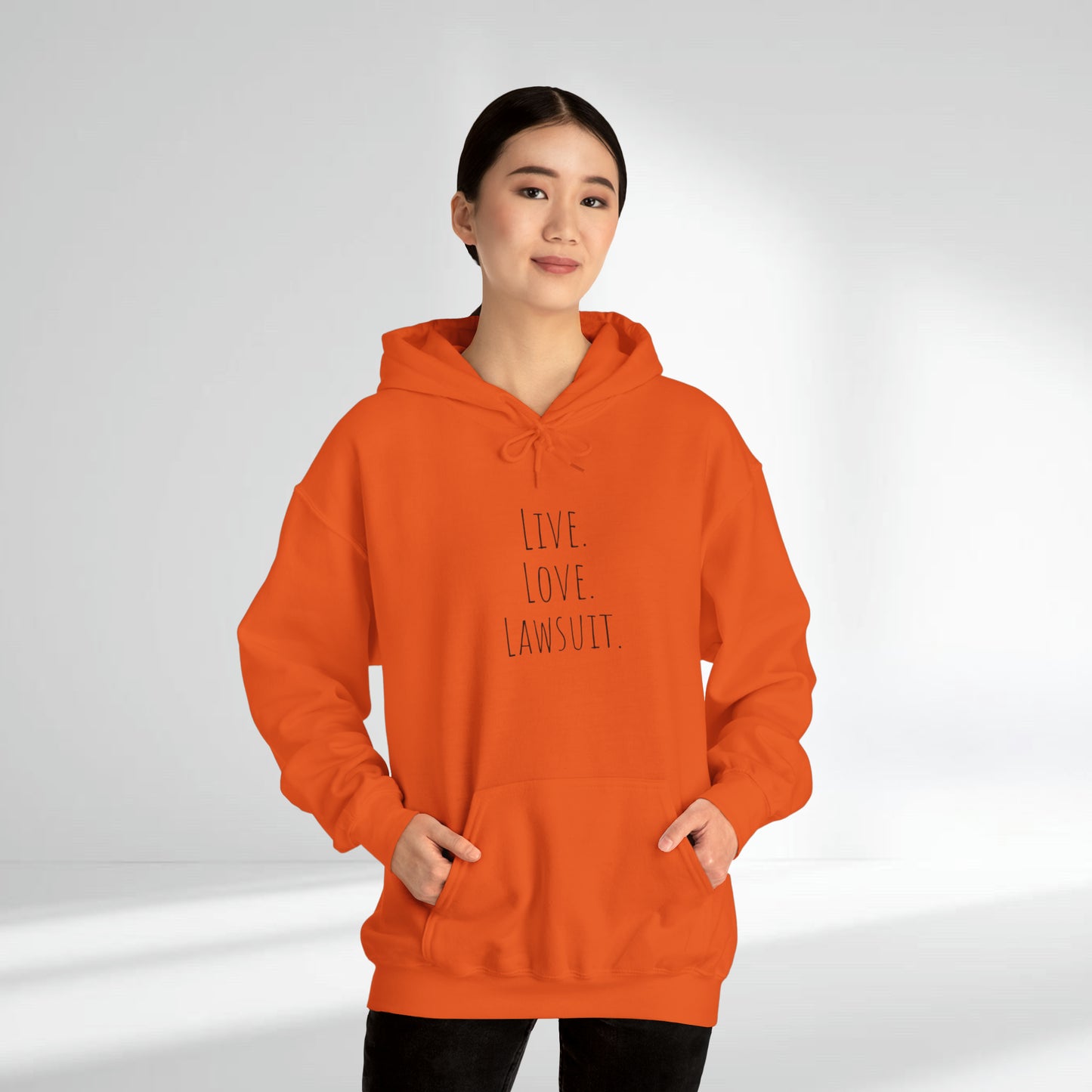 "Live. Laugh. Lawsuit." Statement Unisex Heavy Blend™ Hooded Sweatshirt - Hoodie